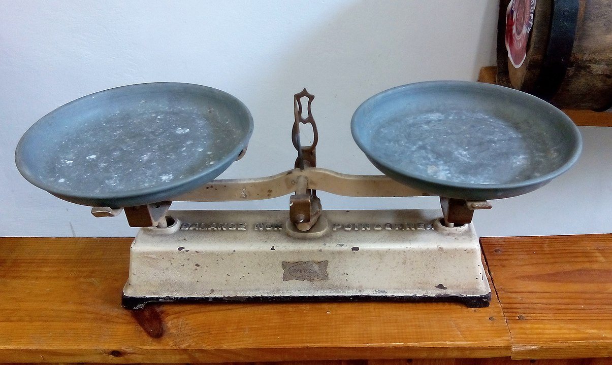 Photograph of an old-fashioned scale in equilibrium.