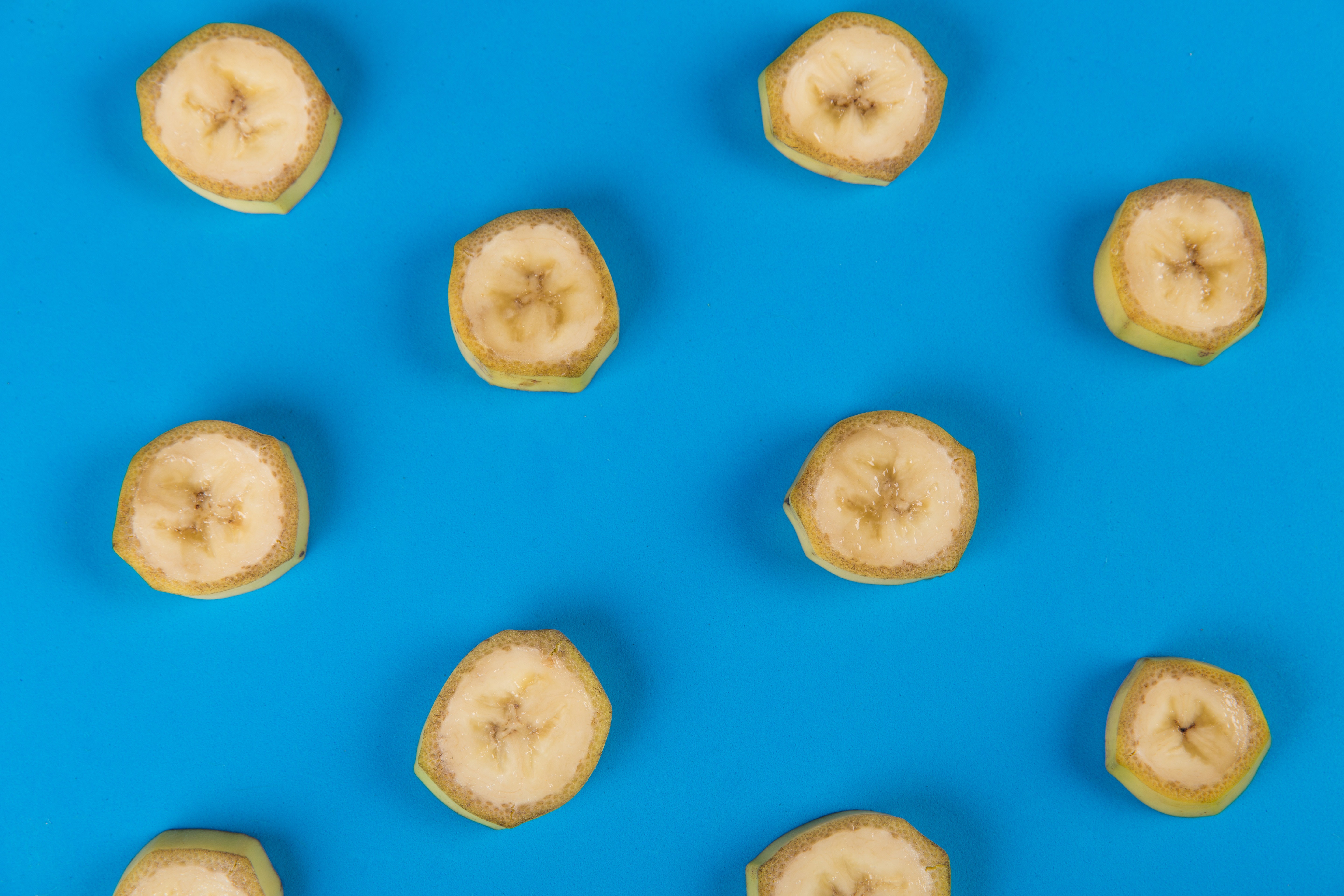 slices of bananas on a bright blue background 