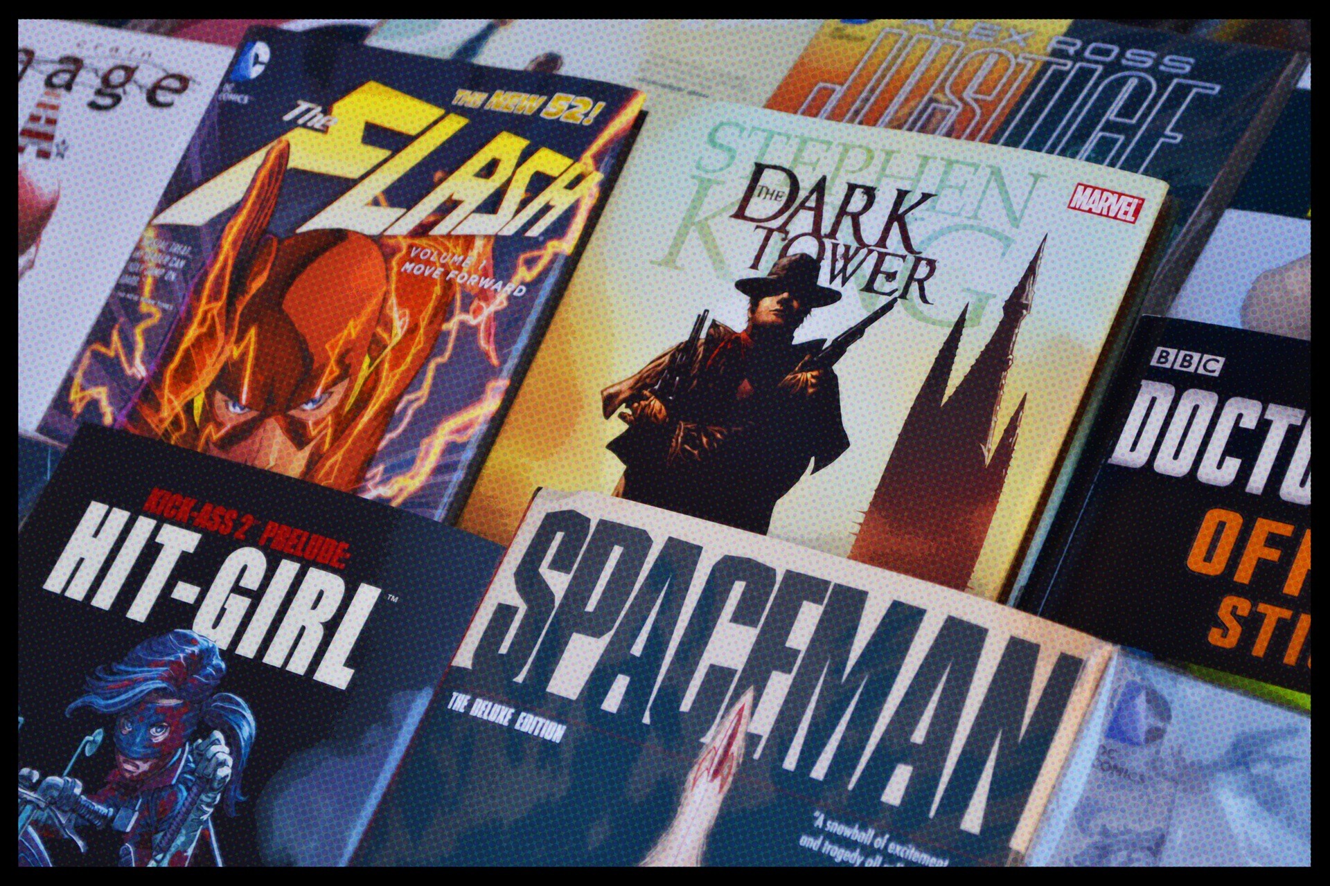 An array of comic books including Marvel and BBC covers
