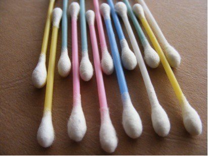 Yellow, green, pink, and blue cotton swabs are shown.