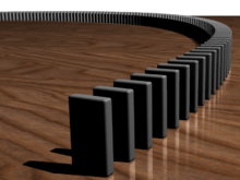 A row of dominoes. Image credits to wikipedia.