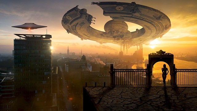 UFO invasion in a futuristic city at sunset
