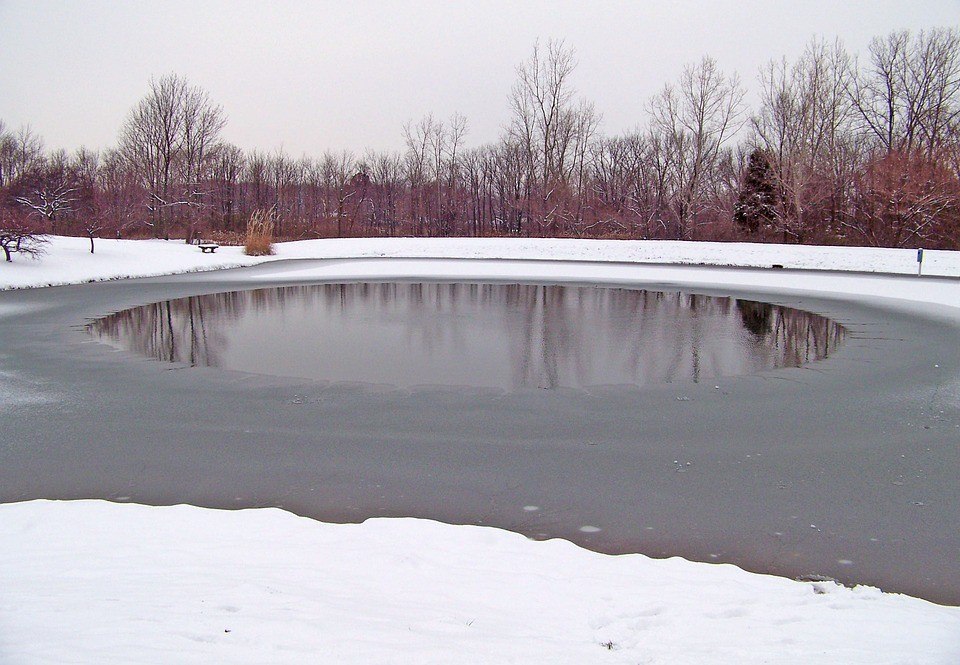 A partially frozen pond