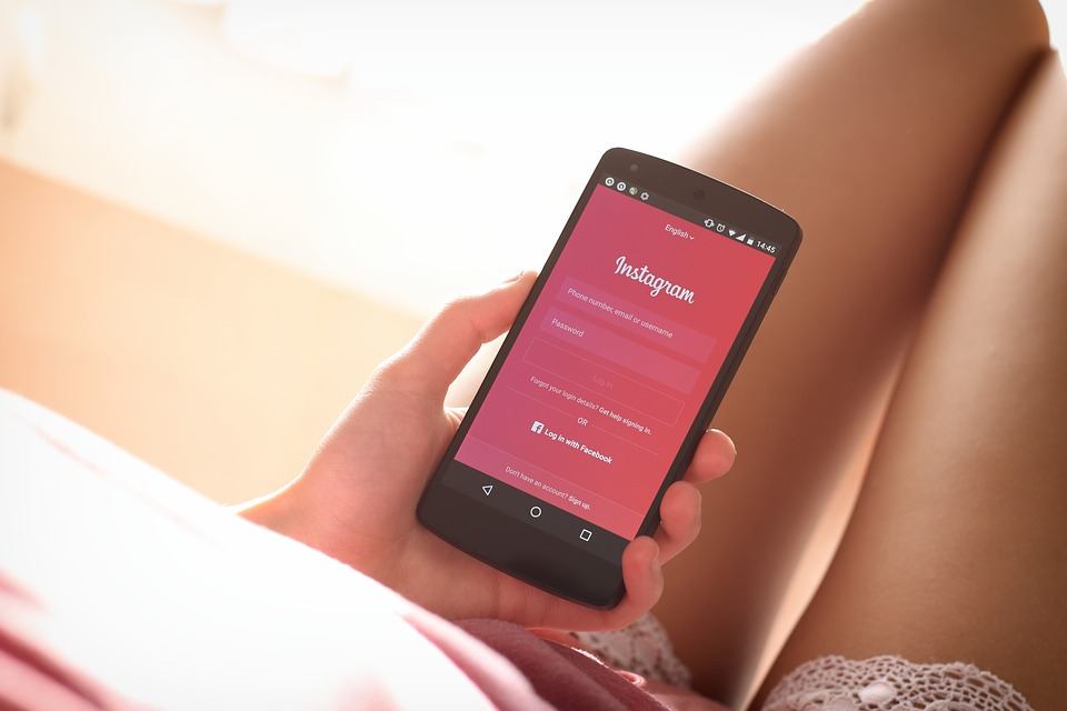 A photo of an Android phone logging into Instagram