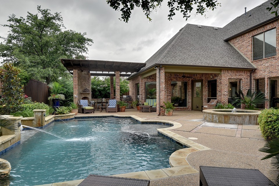 image of a house with a backyard pool