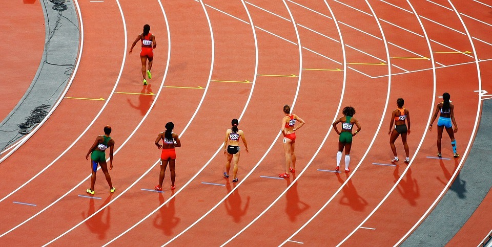 image of runners on a circular track