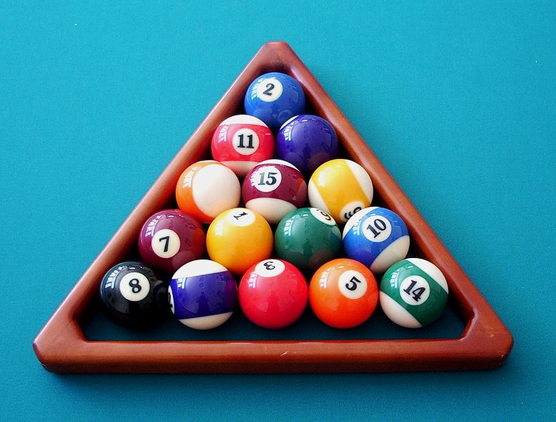A cribbage pool rack containing 15 pool balls.