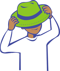 A boy wearing a green hat.