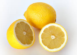 Two lemons are shown. One is cut in half.