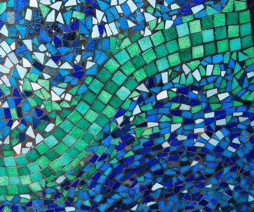 A mosaic with many blue and green tiles is shown.