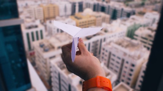 A paper airplane is ready to soar.