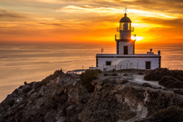 A lighthouse before a sunset.