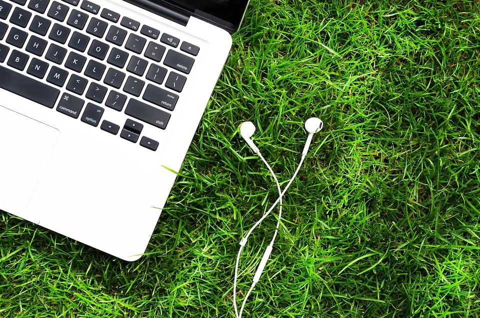 Picture of a laptop with earbuds