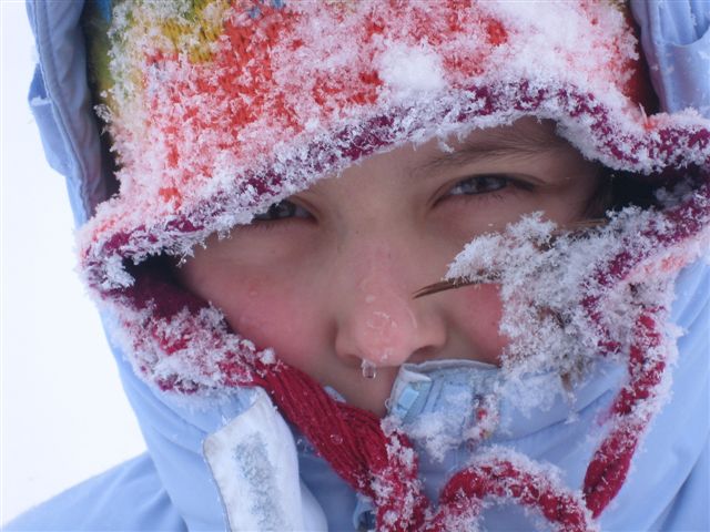 A girl out in a blizzard.