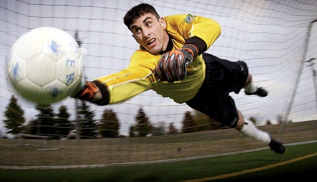 Goalie saving a soccer ball