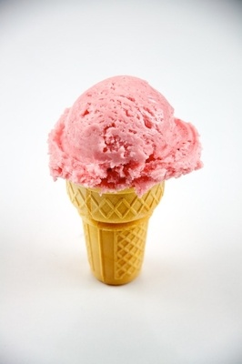 Ice cream cone with pink-colored ice cream.