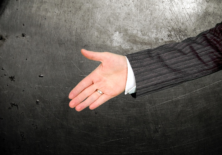 Reaching out to deliver a handshake