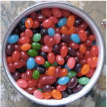 A bowl of jellybeans of different flavors and colors