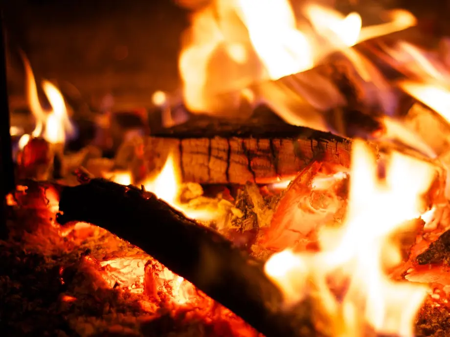 Image description: Close-up photo of wood burning in a fire.