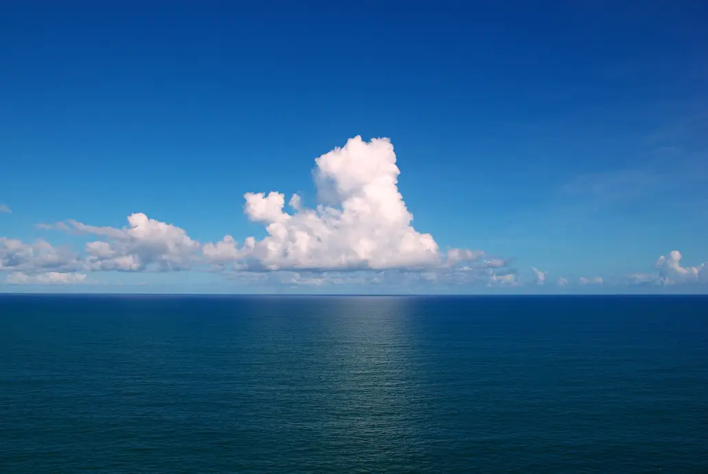 The open ocean extending as far as the eye can see