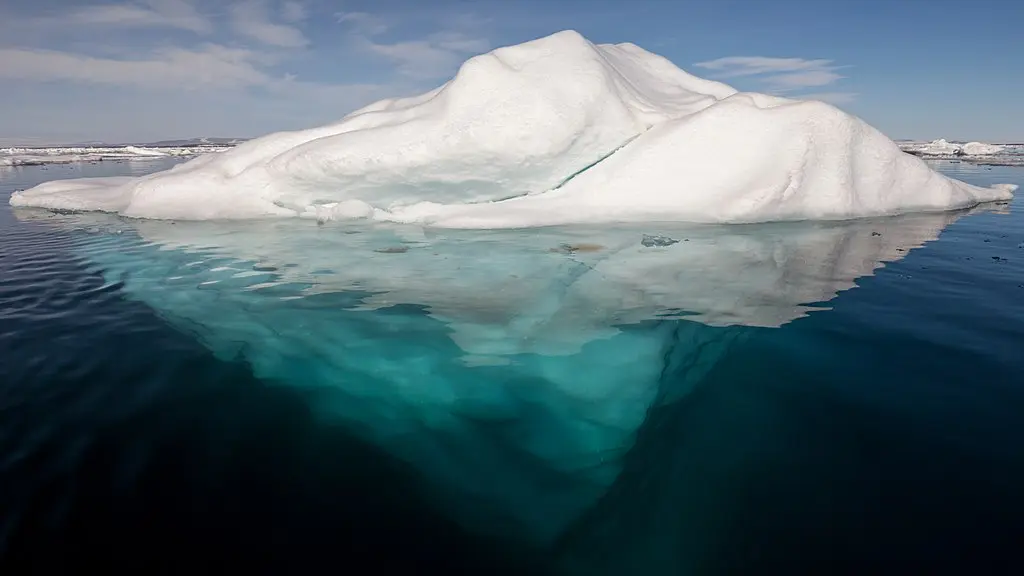 Image description: An iceberg is floating in water