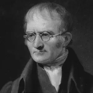 Grayscale portrait of John Dalton: an older man with round wire-rimmed glasses, receding hair and a dark coat.