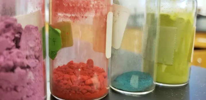 Image description: Colored solid chemical compounds.